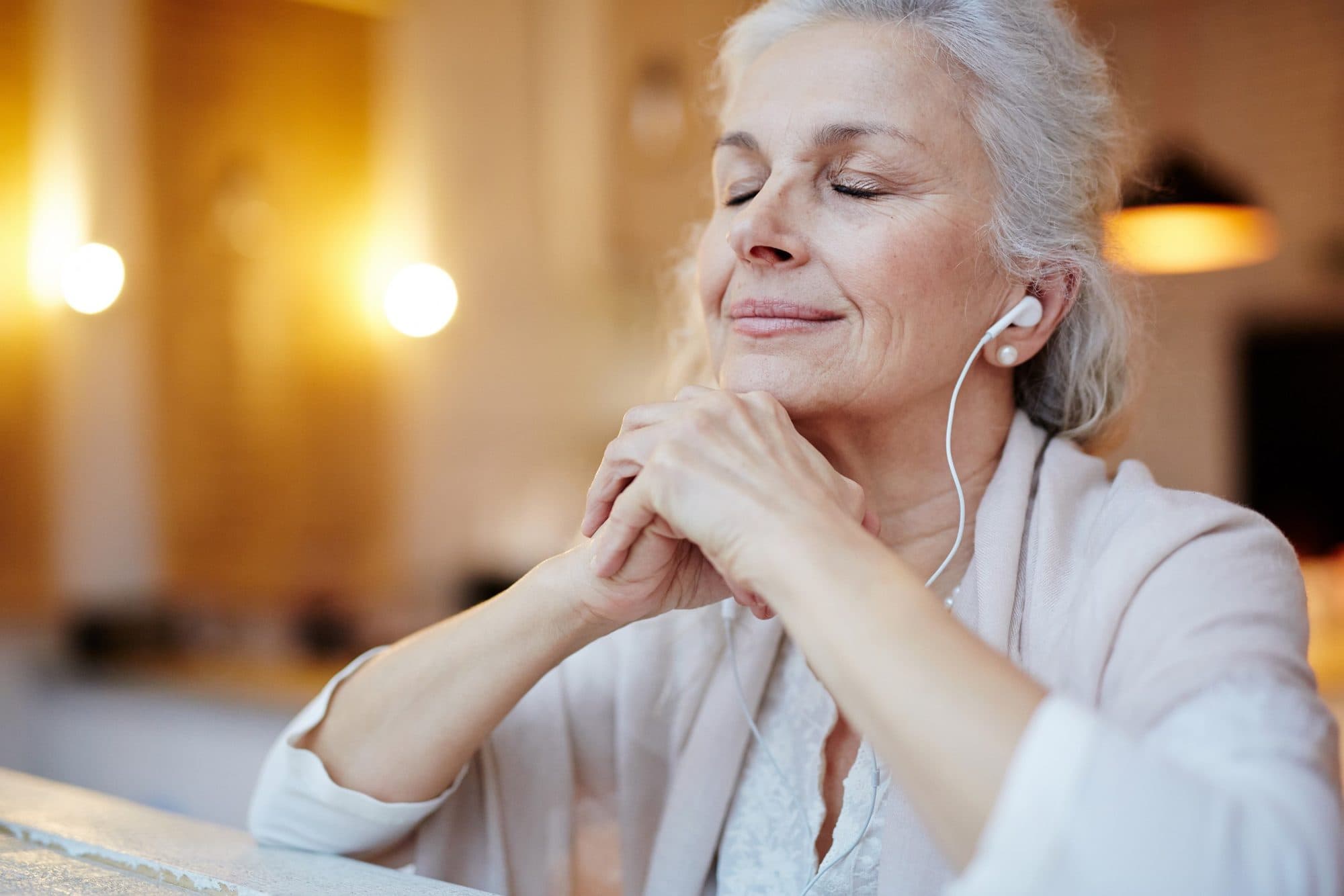 A woman resting with her eyes closed, at peace after finding her bearings